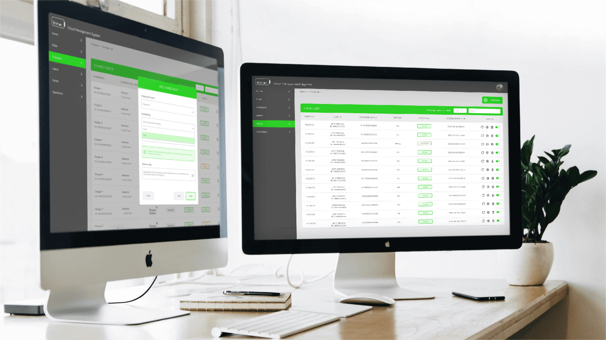 Two mac monitors on an office desk with scattered notebook, keyboard, phone, and plant. Each monitor displaying a different section of the Brim Management Platform for building owners