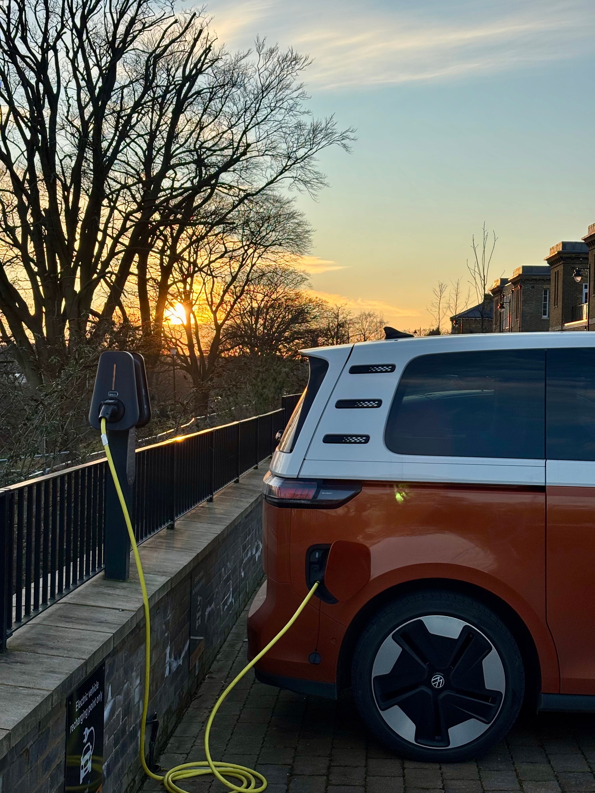 Car park in an evening setting, with a Brim charger